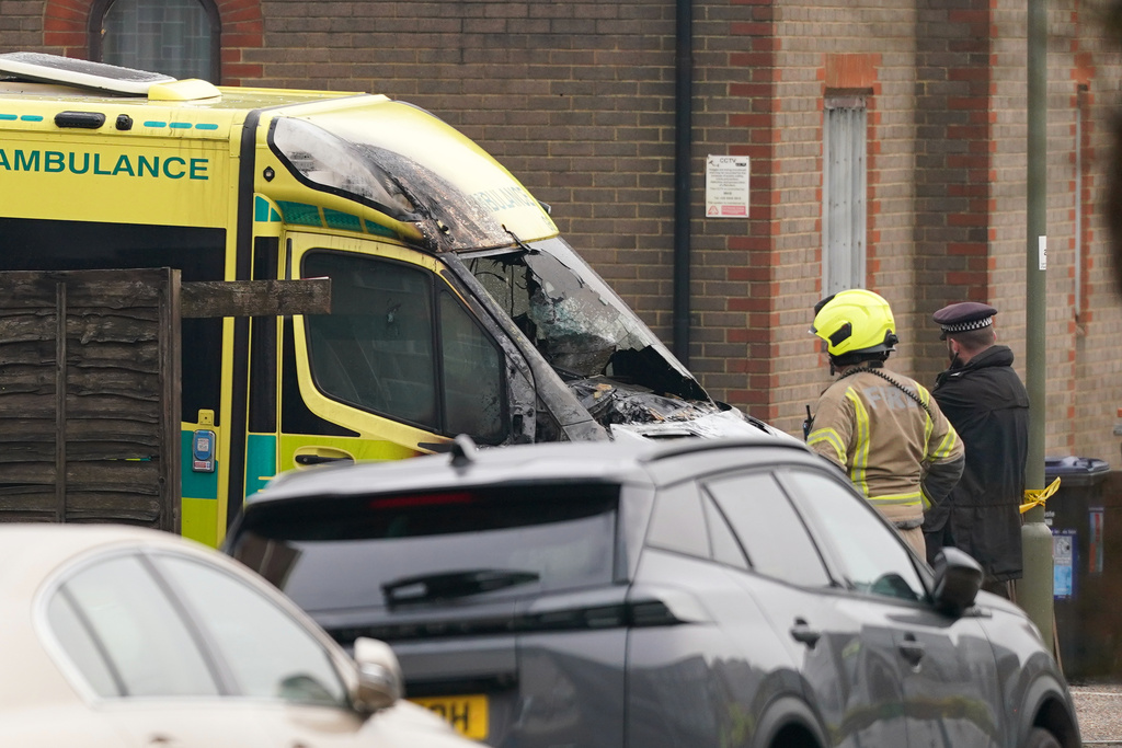 A firefighter and a police officer look at a burnt Ambulance in Golders Green, London, Monday, March 23, 2026 after an apparent arson attack on four vehicles belonging to a Jewish ambulance service, Hatzola Northwest, in London.(AP Photo/Alberto Pezzali)