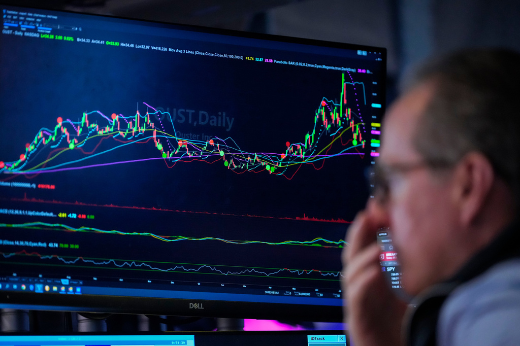 A trader works on the floor of the New York Stock Exchange, Thursday, July 30, 2026, in New York. (AP Photo/Yuki Iwamura)