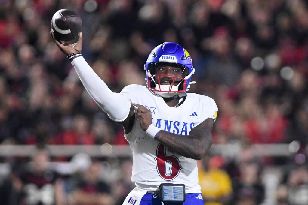 Kansas quarterback Jalon Daniels (6) throws the ball during the second quarter of an NCAA college football game against Texas Tech, Saturday, Oct. 11, 2025, in Lubbock, Texas. (AP Photo/Annie Rice)