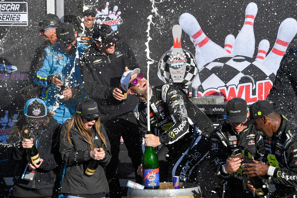 Shane Van Gisbergen, center, celebrates with his team after winning a NASCAR Cup Series auto race, Sunday, May 10, 2026, in Watkins Glen, N.Y. (Photo/Adrian Kraus)