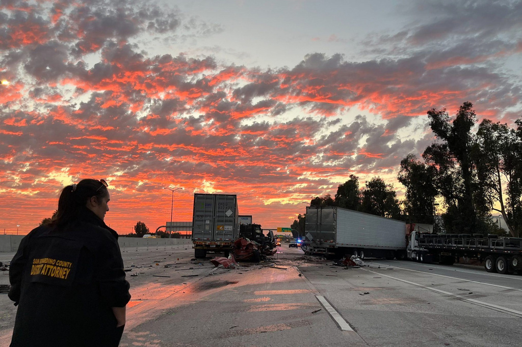 In this photo provided by the San Bernardino County District Attorney’s Office High Tech Crimes Unit, shows officials processing the scene of a deadly multi-vehicle crash Tuesday, Oct. 21, 2025, in Ontario, Calif. (San Bernardino County District Attorney’s Office High Tech Crimes Unit via AP)