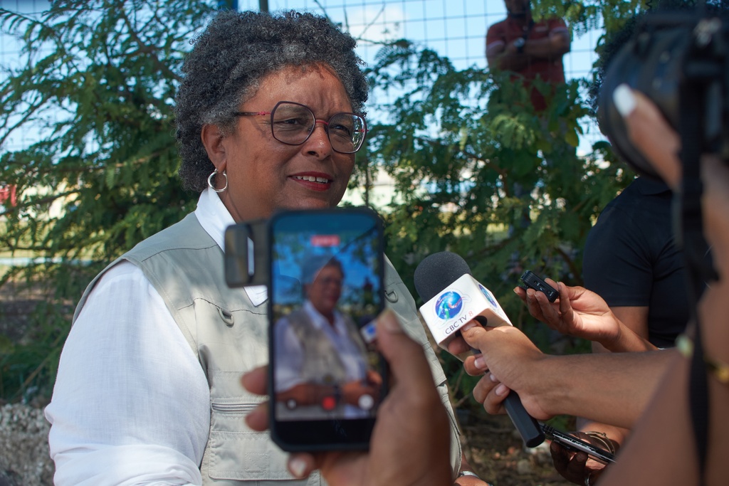 Barbados Prime Minister Mia Amor Mottley talks with the press after casting her ballot for the general election, as she runs for office again, in Bridgetown, Barbados, Wednesday, Feb. 11, 2026. (AP Photo/Kerrie Eversley)