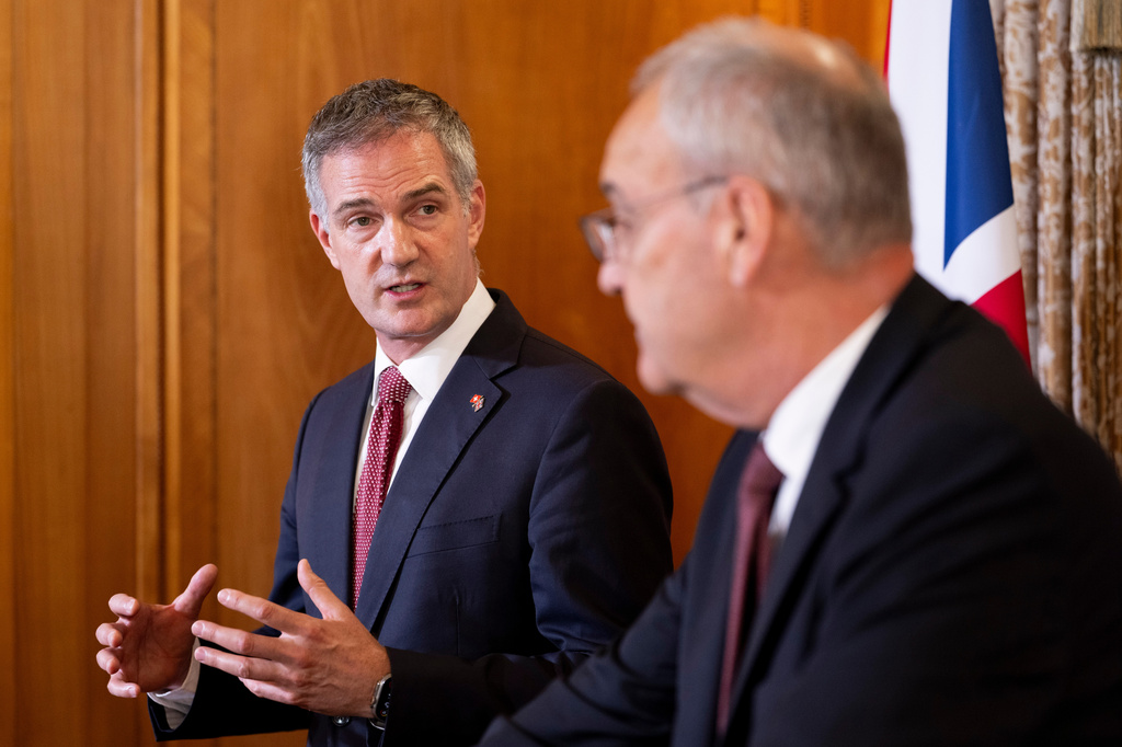 Britain's Secretary of State for Business and Trade, Peter Kyle, left, and Swiss Federal President Guy Parmelin talk prior to a press briefing, held as part of a bilateral meeting, at the Hotel Bellevue Palace in Bern, Switzerland, Monday, July 13, 2026. Parmelin and Kyle announced the conclusion of negotiations on a modernised free trade agreement between Switzerland and the United Kingdom. (Anthony Anex/Keystone via AP)