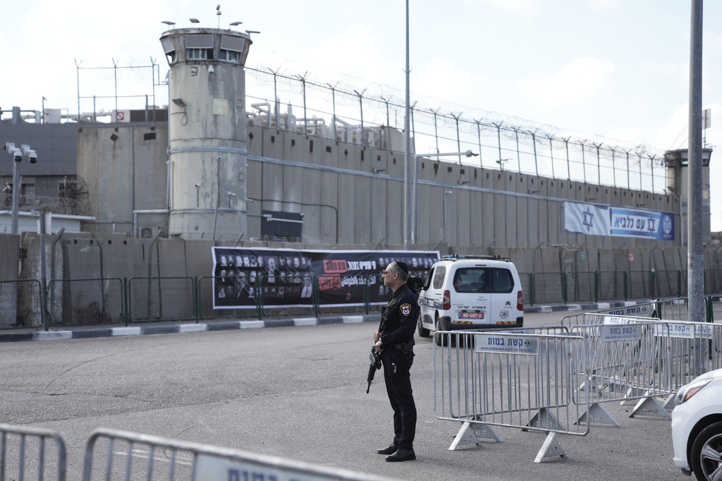 FILE - An Israeli police officer stands outside Ofer military prison near Jerusalem, on Oct. 13, 2025. (AP Photo/Mahmoud Illean, File)