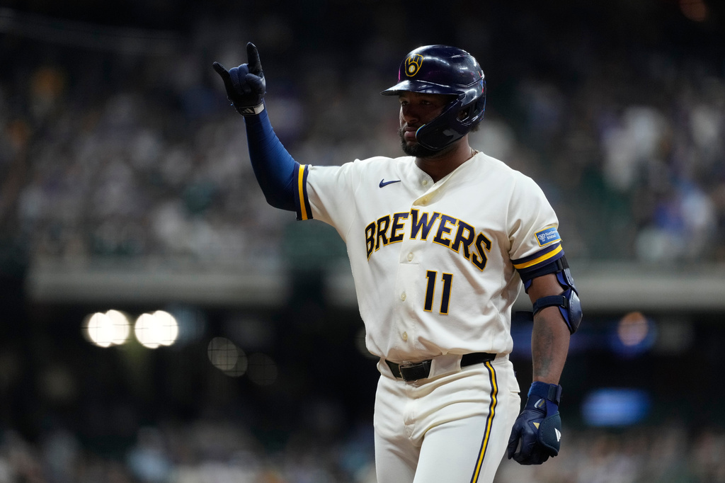 Milwaukee Brewers' Jackson Chourio gestures after hitting an RBI single during the fifth inning of a baseball game against the Seattle Mariners, Tuesday, Aug. 18, 2026, in Milwaukee. (AP Photo/Aaron Gash)