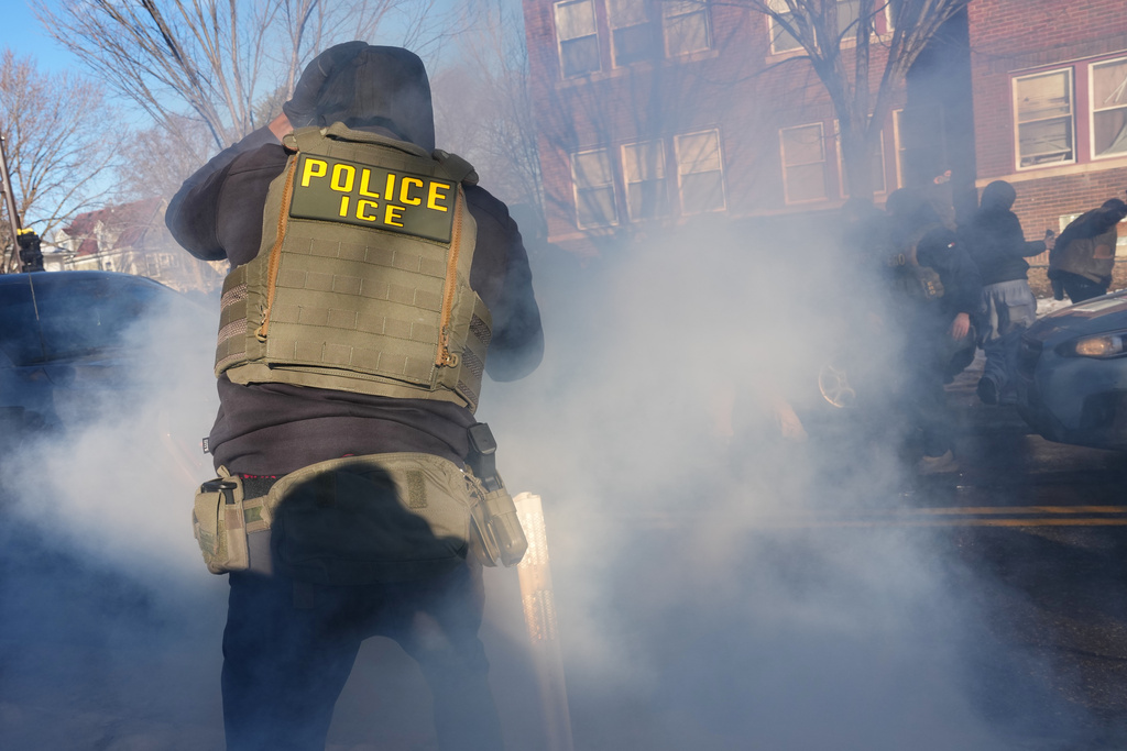 Tear gas is deployed amid protesters near the scene where Renee Good was fatally shot by an ICE officer last week, Tuesday, Jan. 13, 2026, in Minneapolis.(AP Photo/Adam Gray)