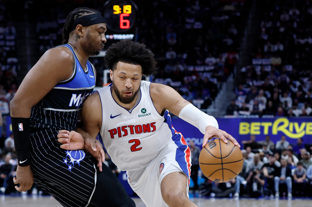 Detroit Pistons guard Cade Cunningham (2) drives against Orlando Magic center Wendell Carter Jr. (34) during the first half in Game 5 of a first-round NBA basketball playoffs series Wednesday, April 29, 2026, in Detroit. (AP Photo/Duane Burleson)