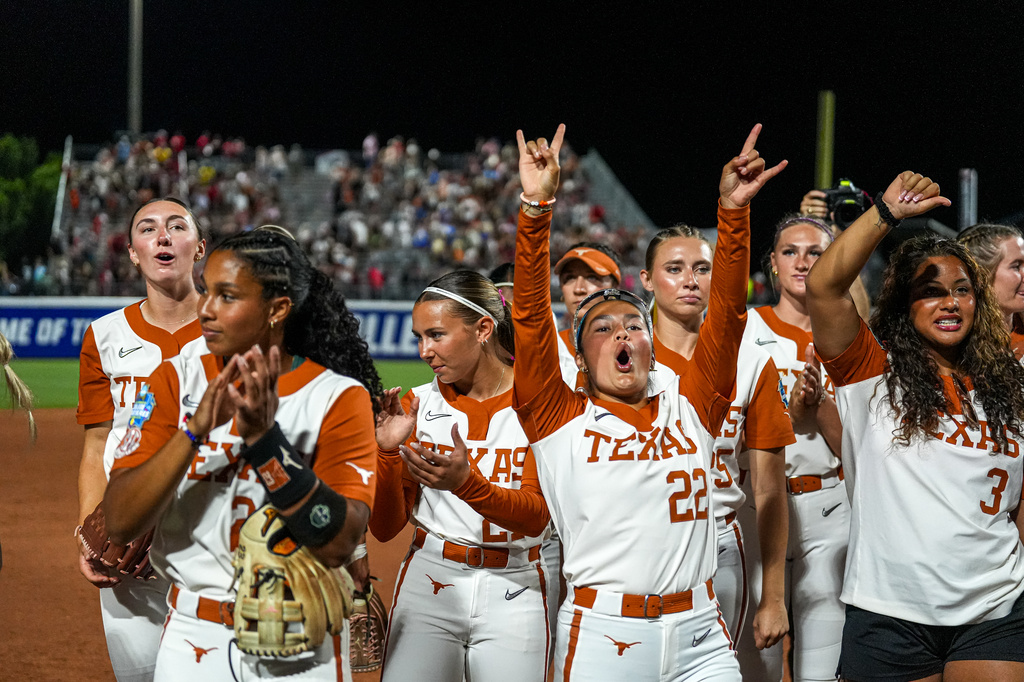 The Texas Longhorns celebrate winning game one of the NCAA Women's College World Series against Texas Tech at Devon Park on Wednesday, June 3, 2026 in Oklahoma City, Oklahoma.(Aaron E. Martinez/Austin American-Statesman via AP)