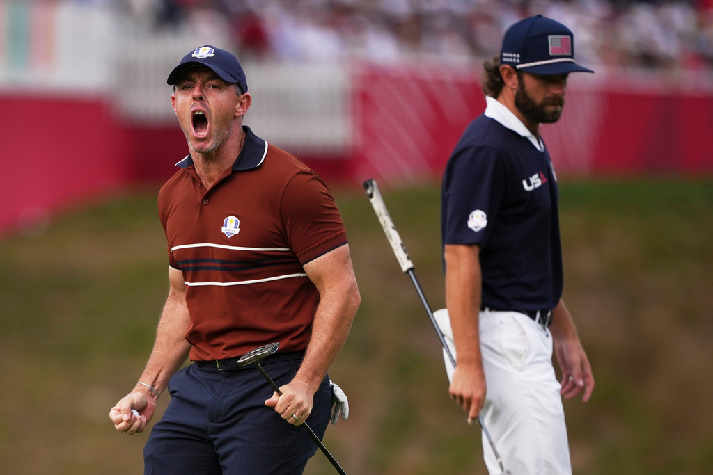Europe's Rory McIlroy celebrates after a putt on the 14th hole at Bethpage Black golf course during the Ryder Cup golf tournament, Saturday, Sept. 27, 2025, in Farmingdale, N.Y. (AP Photo/Matt Slocum)