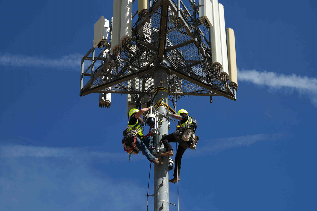Contractors inspect Pano AI cameras used for detecting wildfires Monday, April 20, 2026, in Aurora, Colo. (AP photo/Brittany Peterson)