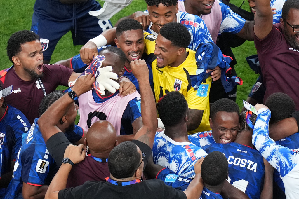 Cape Verde goalkeeper Marcio Rosa (12) celebrates with teammates after advancing during the World Cup Group H soccer match between Cape Verde and Saudi Arabia in Houston, Friday, June 26, 2026. (AP Photo/Eric Gay) CORRECTION: Corrects ID to Cape Verde goalkeeper Marcio Rosa (12), not Cape Verde goalkeeper Vozinha (1).