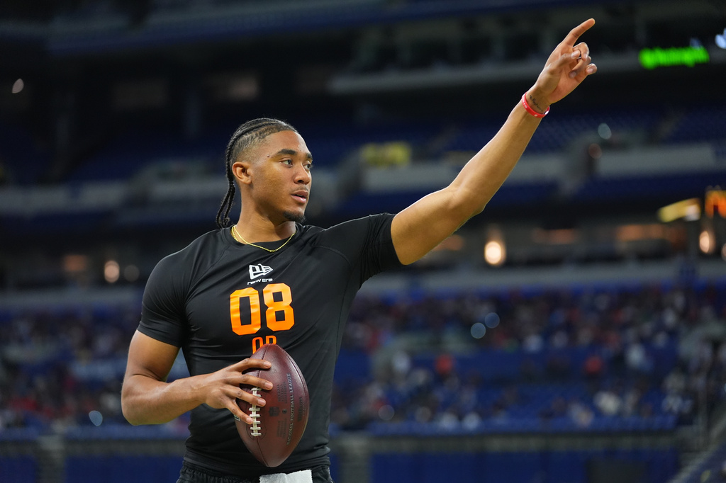 FILE - Arkansas quarterback Taylen Green (08) runs a drill at the NFL football scouting combine in Indianapolis, Saturday, Feb. 28, 2026. (AP Photo/Julio Cortez, , File)
