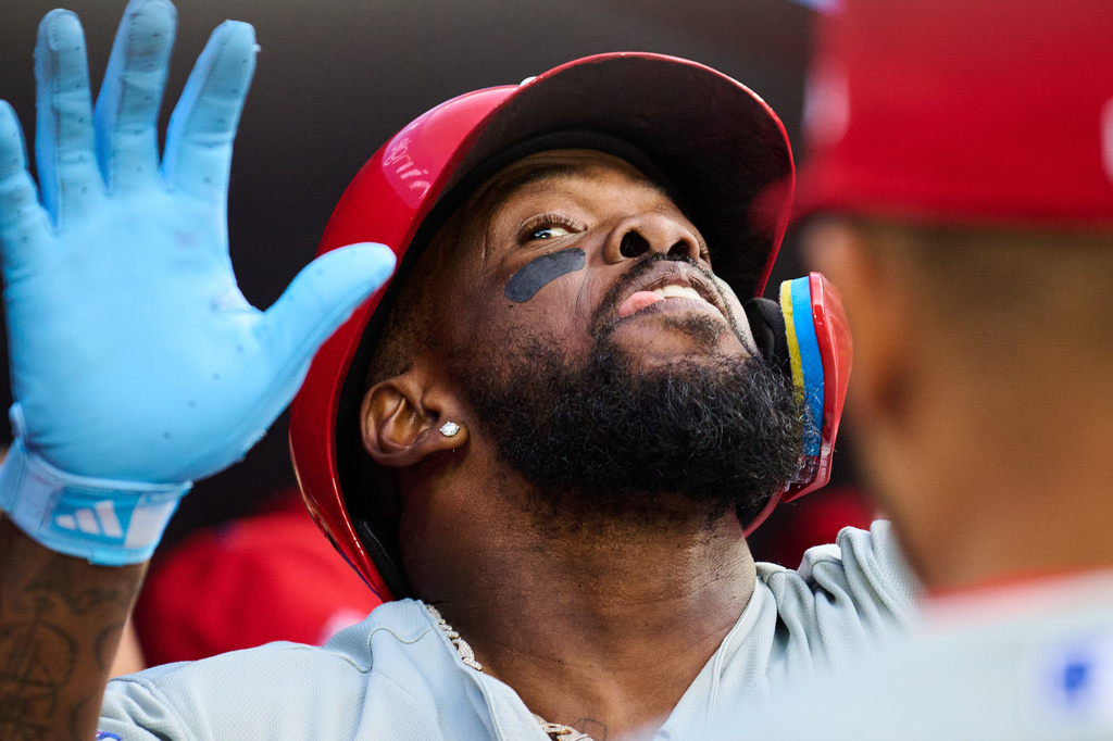 Philadelphia Phillies' Adolis Garcia celebrates with teammates after hitting a two-run home run against the Toronto Blue Jays during second-inning baseball game action in Toronto, Monday, June 8, 2026. (Sammy Kogan/The Canadian Press via AP)