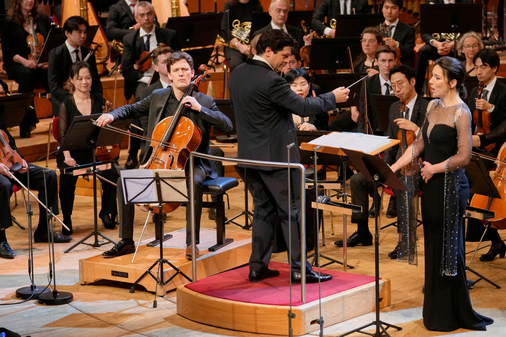 FILE - Chief conductor Cristian Macelaru , center, performs with the WDR symphony orchestra at the traditional President's charity concert at the symphonic concert hall Koelner Philharmonie in Cologne, Germany, April 13, 2025. (AP Photo/Martin Meissner, Pool, File)