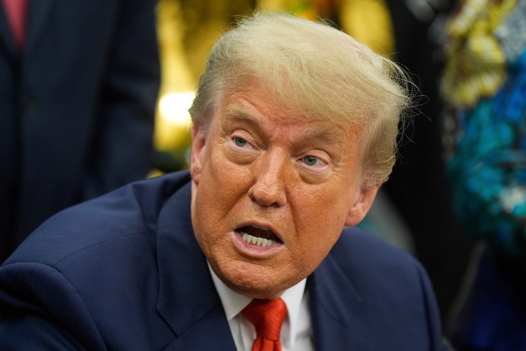 FILE - President Donald Trump answers questions from reporters as he meets with Congo's Foreign Minister Therese Kayikwamba Wagner, and Rwanda's Foreign Minister Olivier Nduhungirehe, Friday, June 27, 2025, in the Oval Office at the White House in Washington. (AP Photo/Manuel Balce Ceneta, File)