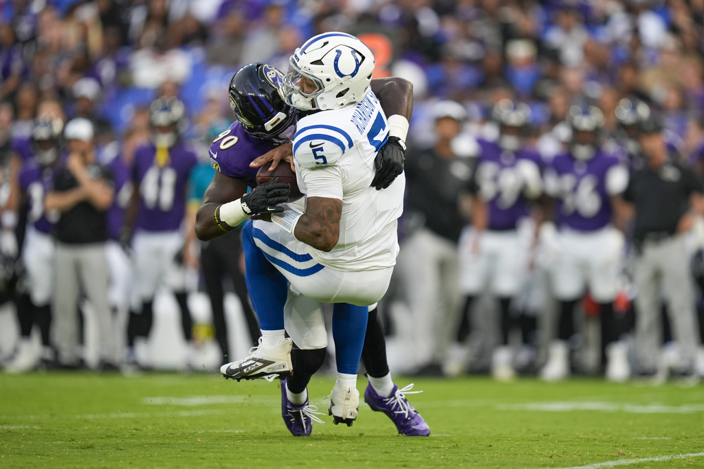 Indianapolis Colts quarterback Anthony Richardson Sr. (5) is sacked by Baltimore Ravens linebacker David Ojabo (90) during the firs half of an NFL preseason football game Thursday, Aug. 7, 2025, in Baltimore. (AP Photo/Alex Brandon)