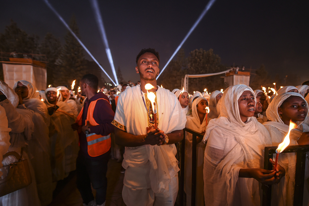 Ethiopian pilgrims pray during a Mass service for Ethiopian Christmas at the Bole Medhane Alem cathedral in Addis Ababa, Ethiopia, Monday, Jan. 6, 2025. (AP Photo)