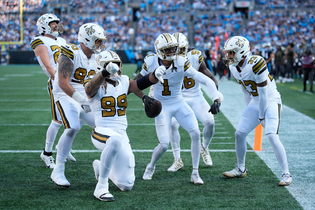 New Orleans Saints cornerback Alontae Taylor celebrates intercepting a pass intended for Carolina Panthers wide receiver Tetairoa McMillan during the second half of an NFL football game, Sunday, Nov. 9, 2025, in Charlotte, N.C. (AP Photo/Jacob Kupferman)