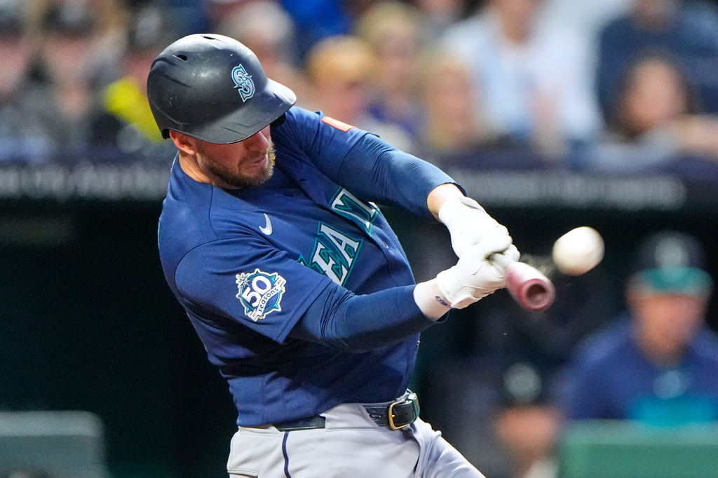 Seattle Mariners' Mitch Garver hits a two-run home run during the seventh inning of a baseball game against the Kansas City Royals, Friday, May 22, 2026, in Kansas City, Mo. (AP Photo/Charlie Riedel)
