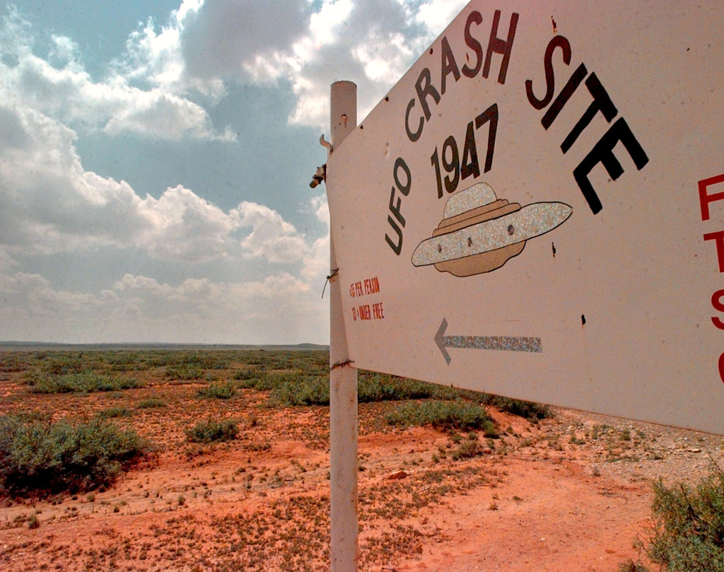 FILE - A sign directs travelers to the "1947 UFO Crash Site Tours" in Roswell, N.M., on June 10, 1997. (AP Photo/Eric Draper, File)