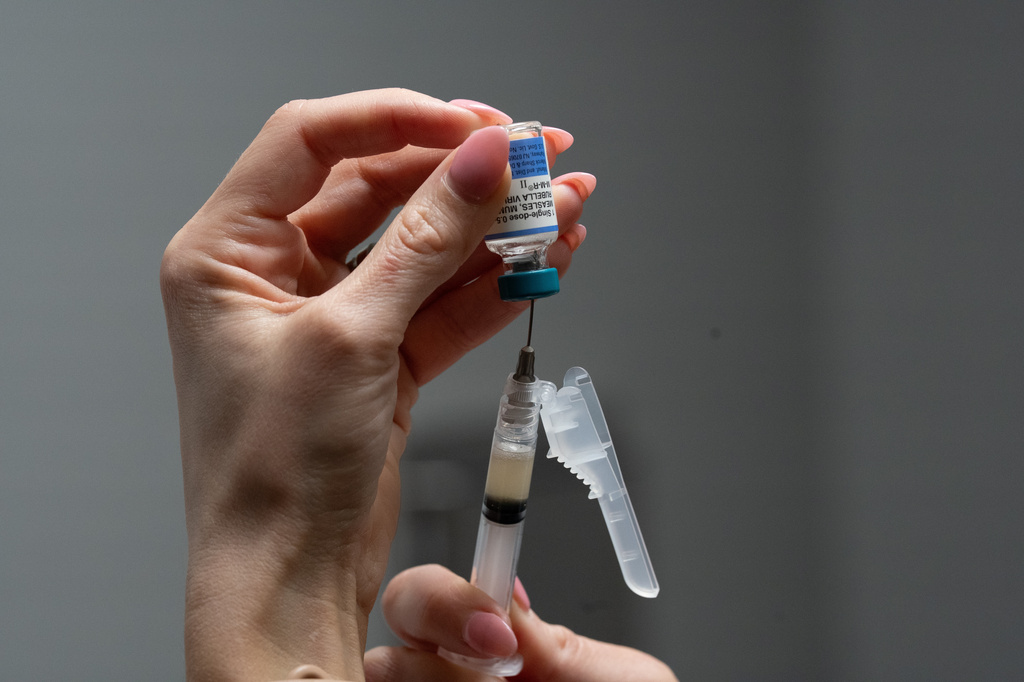 FILE - Lauren Ellenburg, a nurse, prepares a combination measles, mumps and rubella vaccine for a patient at Tiger Pediatrics in Easley, S.C., March 17, 2026. (AP Photo/Mary Conlon, File)