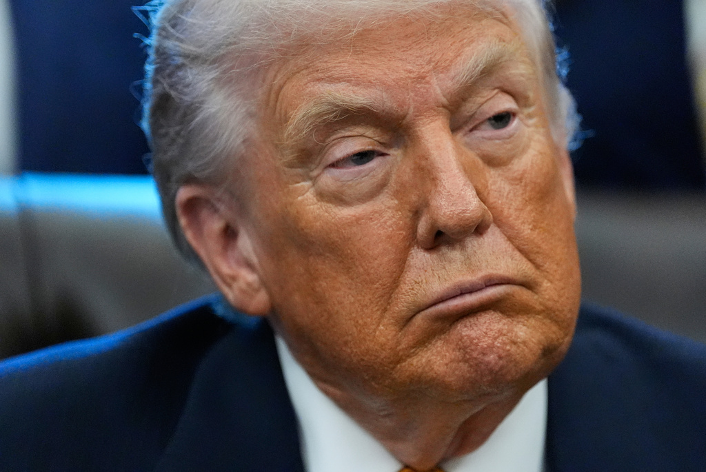 President Donald Trump listens in the Oval Office of the White House, Wednesday, Jan. 14, 2026, in Washington. (AP Photo/Alex Brandon)