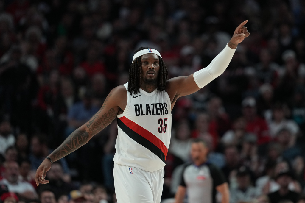 FILE - Portland Trail Blazers center Robert Williams III (35) signals to teammates during the second half in Game 3 of a first-round NBA playoffs basketball series against the San Antonio Spurs in Portland, Ore, Friday, April 24, 2026. (AP Photo/Jenny Kane,File)