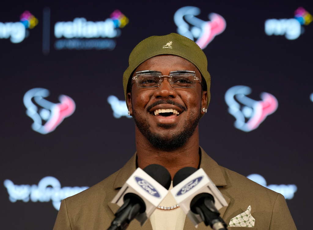 Houston Texans' Azeez Al-Shaair talks about his contract extension during a press conference at the NFL football team's facility, Friday, May 1, 2026, in Houston. (AP Photo/Karen Warren)