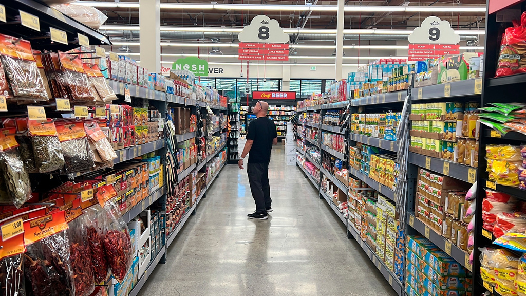 FILE - A customer shops at a Grocery Outlet store in Pleasanton, Calif., on Sept. 15, 2022. (AP Photo/Terry Chea, File)
