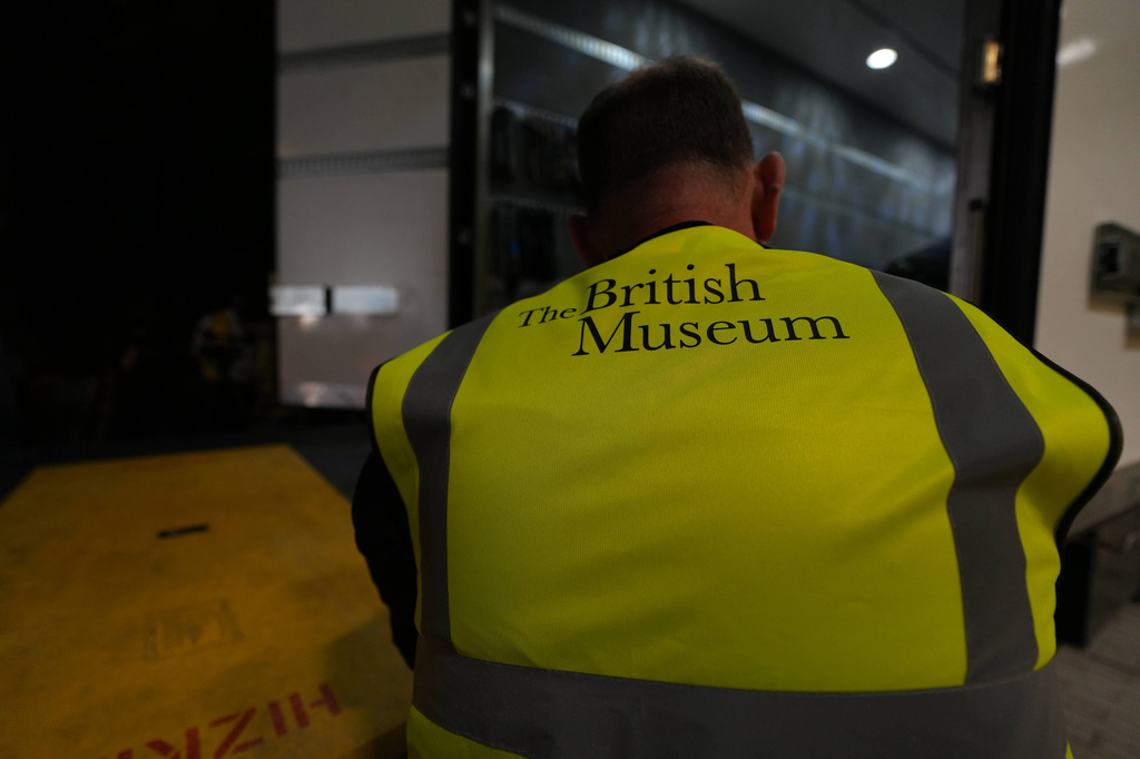 A British Museum worker unloads objects from a truck at the British Museum in London, Friday, July 10, 2026. (AP Photo/Kwiyeon Ha)