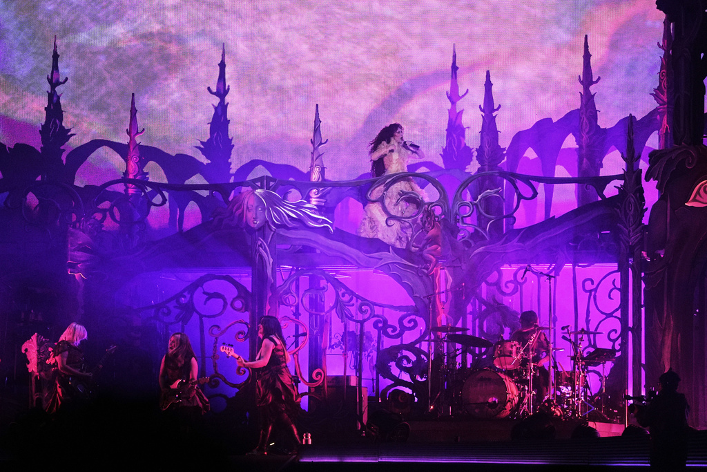 Singer Chappell Roan, top, performs during the Corona Capital music festival in Mexico City, Saturday, Nov. 15, 2025. (AP Photo/Claudia Rosel)