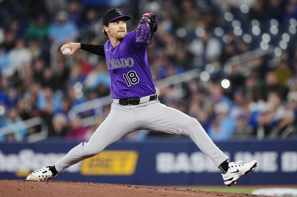 Colorado Rockies pitcher Ryan Feltner (18) works against the Toronto Blue Jays during the first inning of a baseball game in Toronto on Tuesday, March 31, 2026. (Nathan Denette/The Canadian Press via AP)