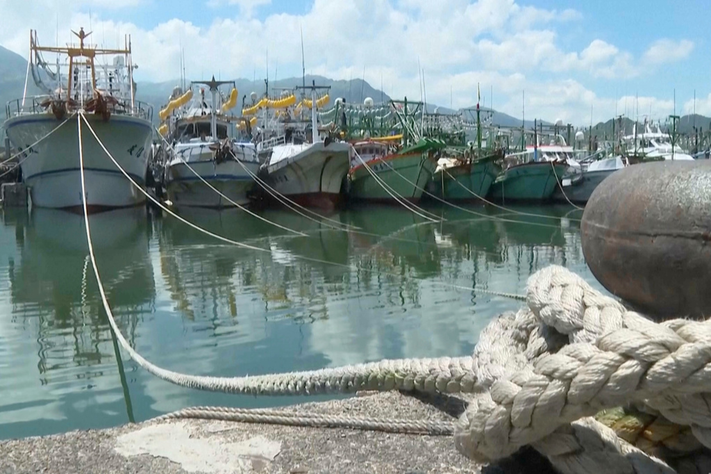 In this image made from video, boats are seen after fishermen secured them at Shen'ao Fishing Port, ahead of Typhoon Bavi along the coast of New Taipei City, Taiwan on Thursday, July 9, 2026. (AP Photo/Taijing Wu)
