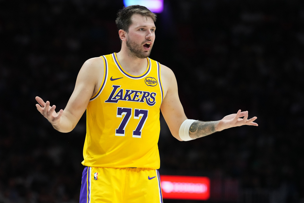 Los Angeles Lakers guard Luka Doncic (77) argues a call during the second half of an NBA basketball game against the Miami Heat, Thursday, March 19, 2026, in Miami. (AP Photo/Lynne Sladky)