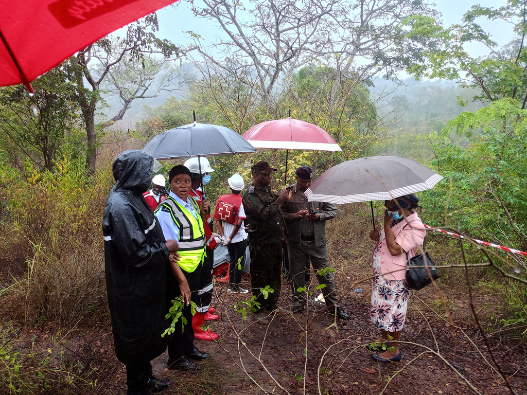 Kenyan officials inspect the scene of a plane crash near Diani, Kenya, Tuesday, Oct. 28, 2025. (AP Photo)