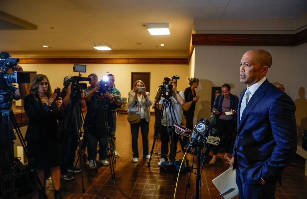 Thomas Otake, right, defense attorney for Gerhardt Konig, speaks to media after Konig's verdict, Wednesday, April 8, 2026, in Honolulu. (Jamm Aquino/Honolulu Star-Advertiser via AP, Pool)