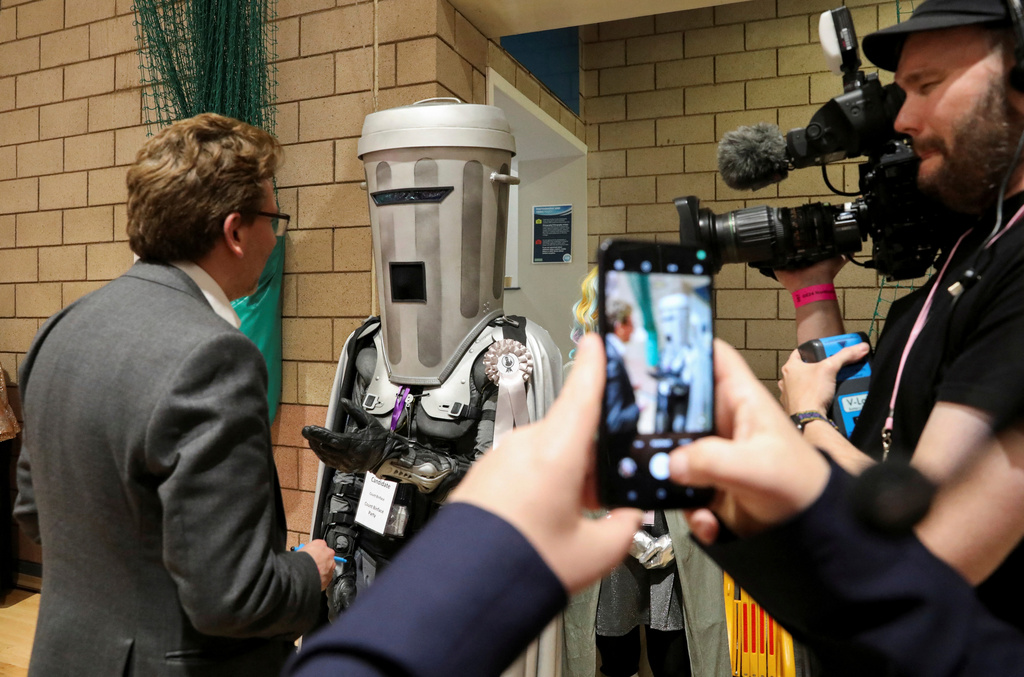 FILE - Independent candidate Count Binface speaks to a journalist as he arrives for the vote count in Britain's general election at the Richmond and Northallerton count center in Northallerton, England, Friday July 5, 2024. (Temilade Adelaja, Pool via AP, file)