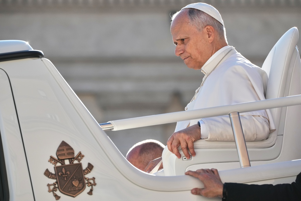 Pope Leo XIV leaves at the end of his weekly general audience in the St. Peter¥s Square at the Vatican, Wednesday, Dec. 10, 2025. (AP Photo/Andrew Medichini)