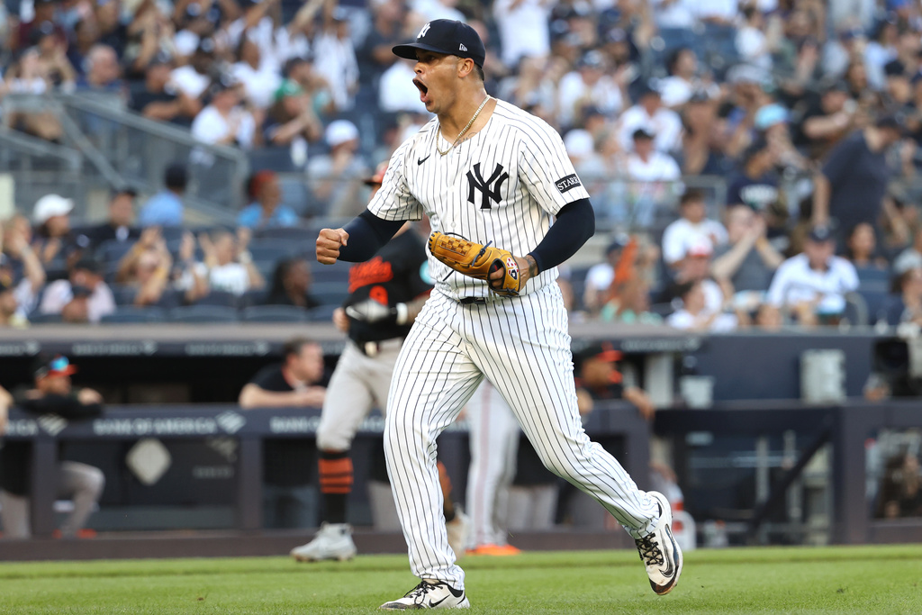 New York Yankees pitcher Fernando Cruz reacts after Baltimore Orioles' Ryan Mountcastle flew out to Yankees outfielder Trent Grisham during the sixth inning of a baseball game Sunday, Sept. 28, 2025, in New York. (AP Photo/Pamela Smith)