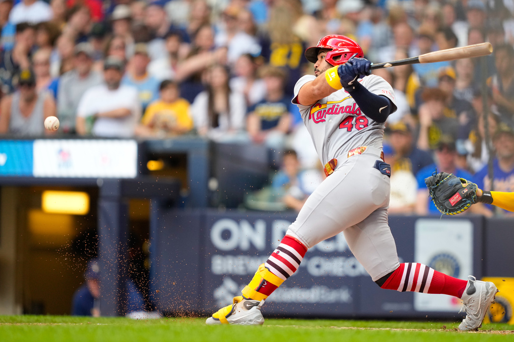 St. Louis Cardinals' Iván Herrera hits a groundout to third base, allowing Victor Scott II to score, during the sixth inning of a baseball game against the Milwaukee Brewers, Monday, May 25, 2026, in Milwaukee. (AP Photo/Kayla Wolf)