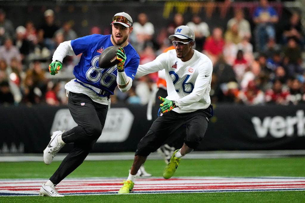AFC tight end Dalton Kincaid (86), of the Buffalo Bills, runs with the ball while defended by NFC cornerback Nahshon Wright (26), of the Chicago Bears, during the first half of the NFL Pro Bowl football game, Tuesday, Feb. 3, 2026, in San Francisco. (AP Photo/Jeff Chiu)