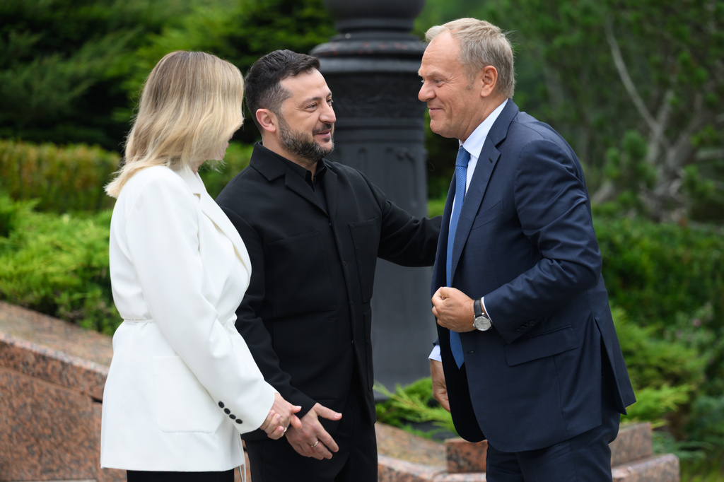 In this photo provided by the Ukrainian Presidential Press Office, Poland's Prime Minister Donald Tusk, right, is welcomed by Ukraine's President Volodymyr Zelensky and his wife Olena Zelenska during a Carpathian 8 Summit in Bukovel, western Ukraine, Friday, Sept. 18, 2026. (Ukrainian Presidential Press Office via AP)