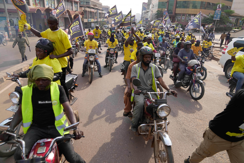 Supporters of Ugandan President Yoweri Museveni celebrate his victory in the presidential election in Kampala, Uganda, Saturday, Jan. 17, 2026. (AP Photo/Brian Inganga)