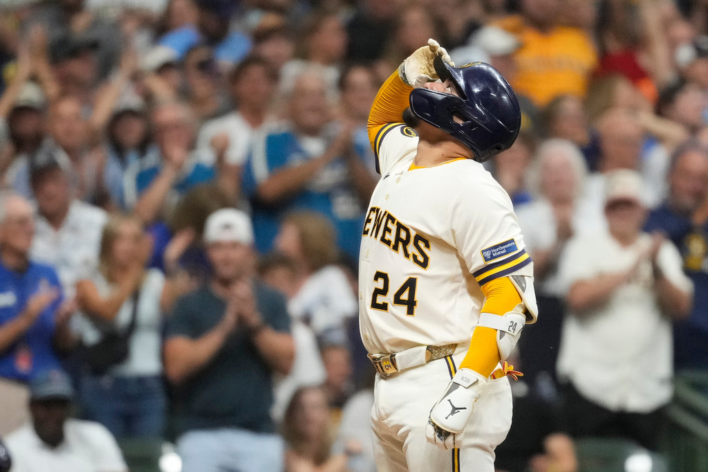 Milwaukee Brewers' William Contreras gestures as he crosses home plate after hitting a solo home run during the sixth inning of a baseball game against the Pittsburgh Pirates, Wednesday, Aug. 5, 2026, in Milwaukee. (AP Photo/Aaron Gash)