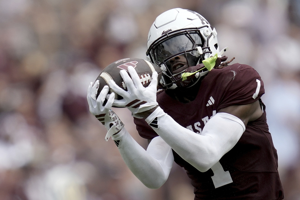 Texas A&M wide receiver Mario Craver (1) cathces a pass for a 72 yard catch and run touchdown against Utah State during the second half of an NCAA college football game Saturday, Sept. 6, 2025, in College Station, Texas. (AP Photo/Sam Craft)
