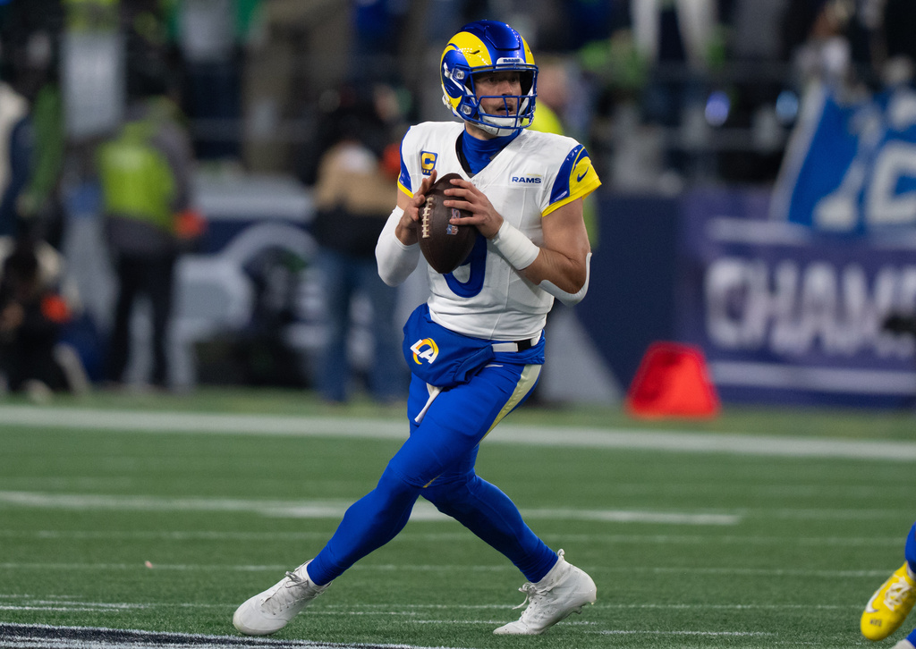 FILE - Los Angeles Rams quarterback Matthew Stafford drops back to pass during a NFC Championship football game against the Seattle Seahawks, Jan. 25, 2026, in Seattle. (AP Photo/Stephen Brashear, File)