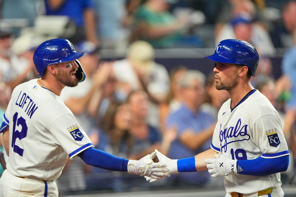 Kansas City Royals' Michael Massey, right, celebrates with Nick Loftin (12) after hitting a solo home run during the seventh inning of a baseball game against the Minnesota Twins, Wednesday, Aug. 5, 2026, in Kansas City, Mo. (AP Photo/Charlie Riedel)