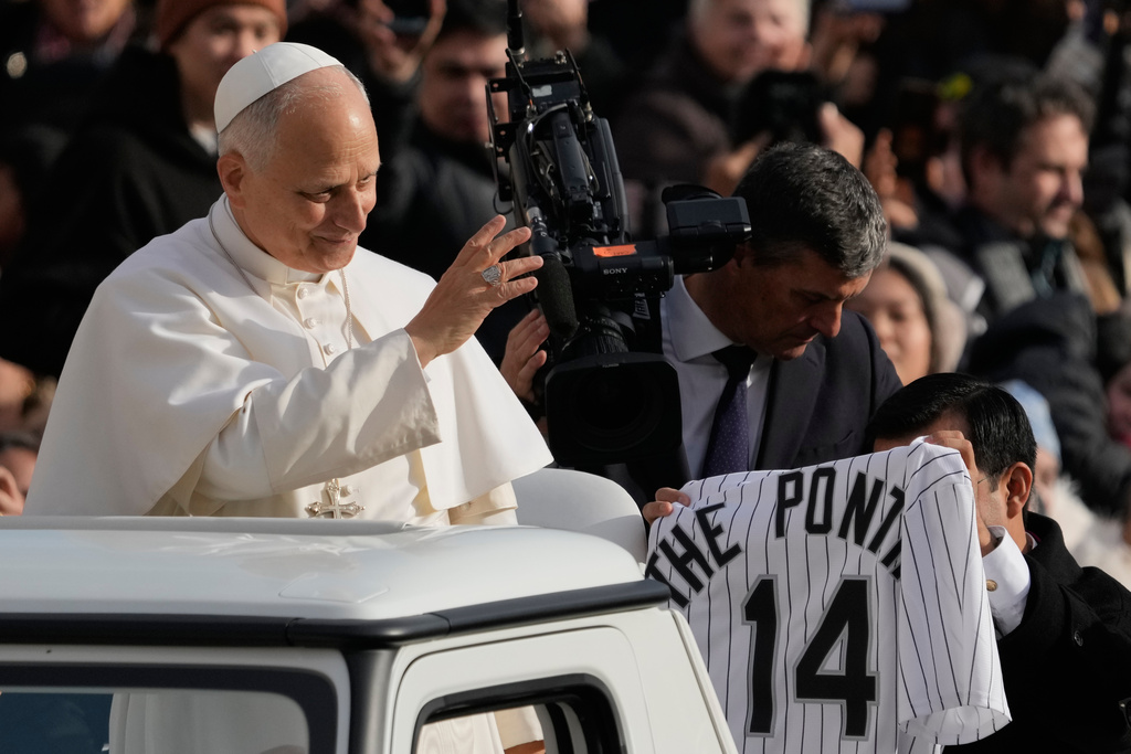 Pope Leo XIV greets faithful as he arrives in St. Peter's Square on the occasion of the last Jubilee audience, at the Vatican, Saturday, Dec. 20, 2025. (AP Photo/Gregorio Borgia)