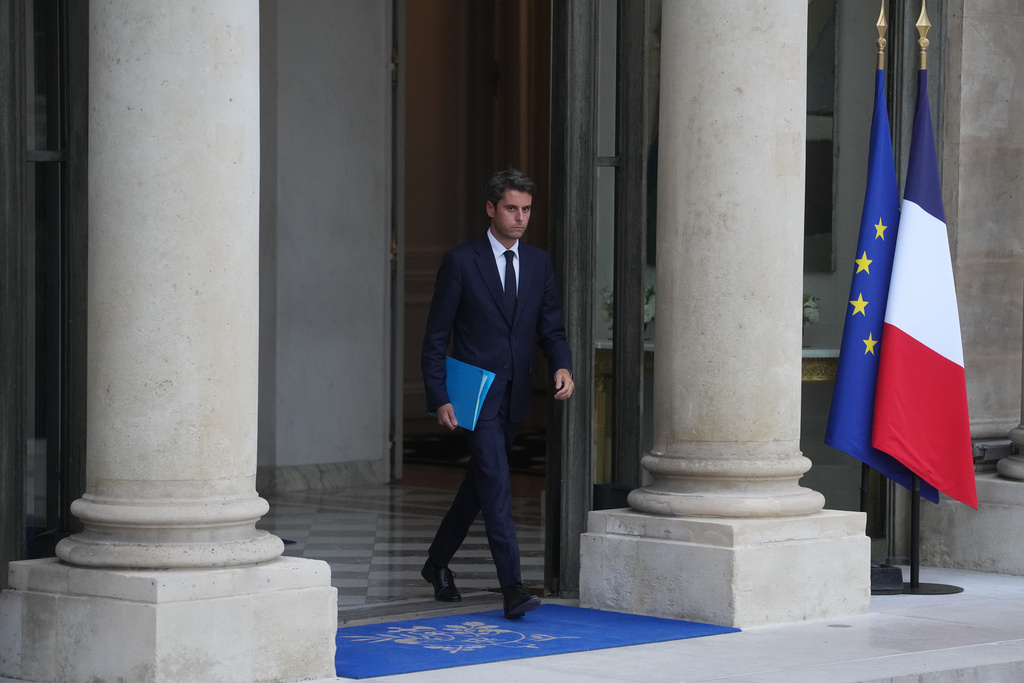 Former French Prime minister Gabriel Attal leaves after a meeting with French president Emmanuel Macron at the Elysee Palace, in Paris, Friday, Oct. 10, 2025. (AP Photo/Thibault Camus)