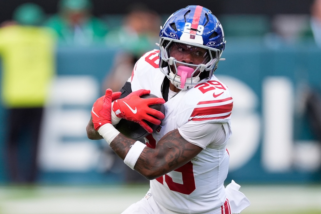 New York Giants running back Tyrone Tracy Jr. (29) runs with the ball during the first half of an NFL football game against the Philadelphia Eagles on Sunday, Oct. 26, 2025, in Philadelphia. (AP Photo/Chris Szagola)